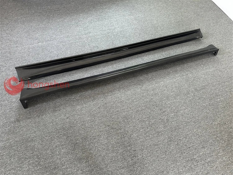 A pair of high-quality top style 3K carbon fiber side skirts for Tesla