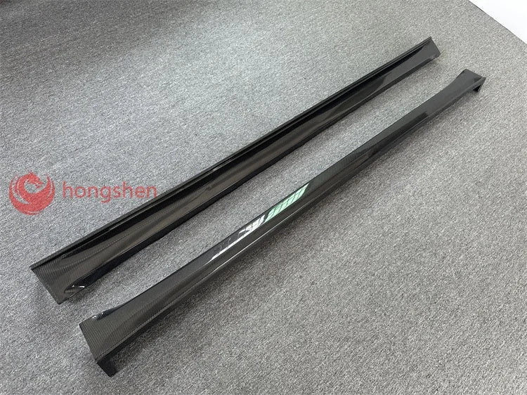 A pair of high-quality top style 3K carbon fiber side skirts for Tesla