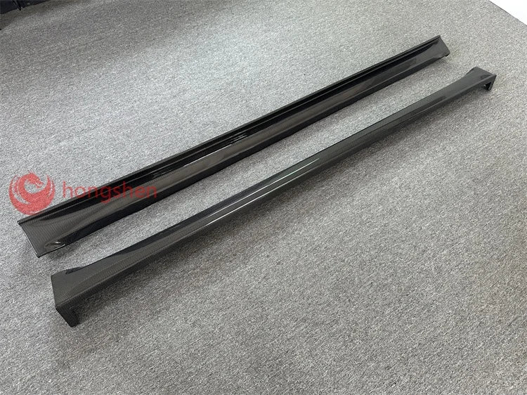 A pair of high-quality top style 3K carbon fiber side skirts for Tesla